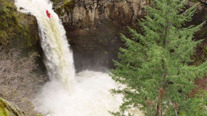 Evan Garcia kayaking waterfall