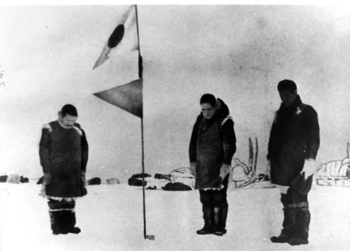 Nobu Shirase raising Japanese flag on Antarctic expedition