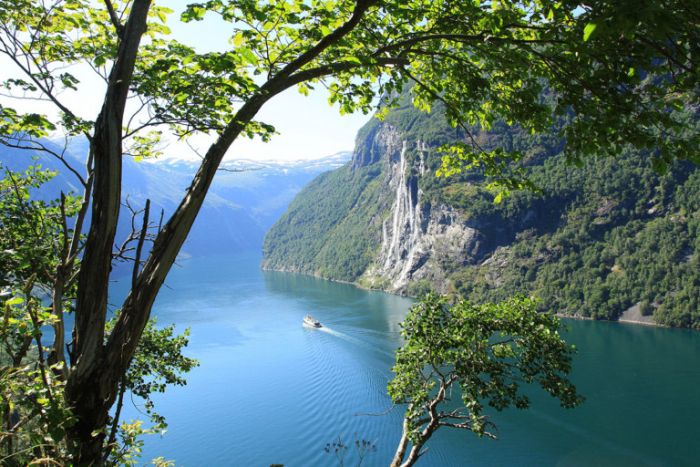  A ferry boat sailing down the Geirangerfjord