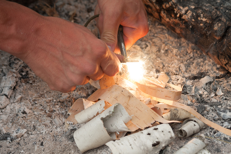 Lighting a fire with a fire steel