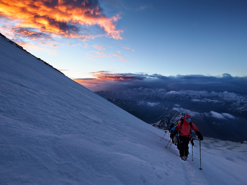 trekking in the sunset on mount elbrus - europe's highest mountain