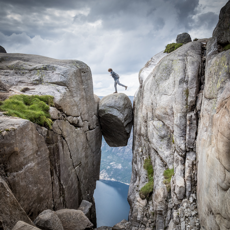 hiker on the kjerag boulder, best hikes in norway