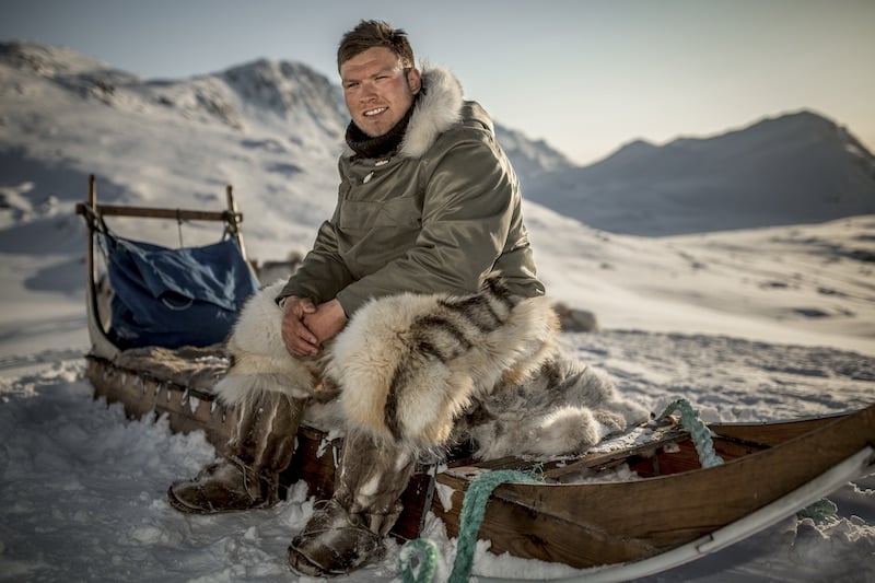 culture greenland travel guide dog sled driver