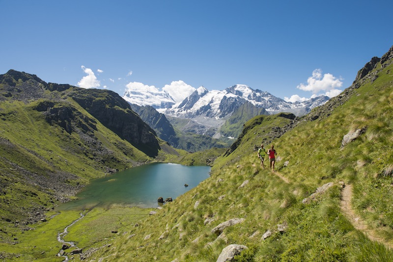 Hikers on the tour of val de bagnes, one of the best hikes in valais, switzerland