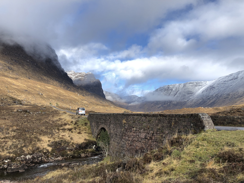 Camper van driving through north-west Scotland