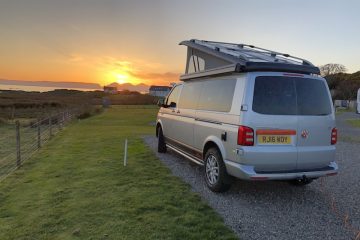 Campervan with a sunset on the west coast of Scotland