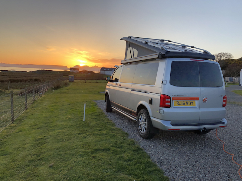 Campervan with a sunset on the west coast of Scotland