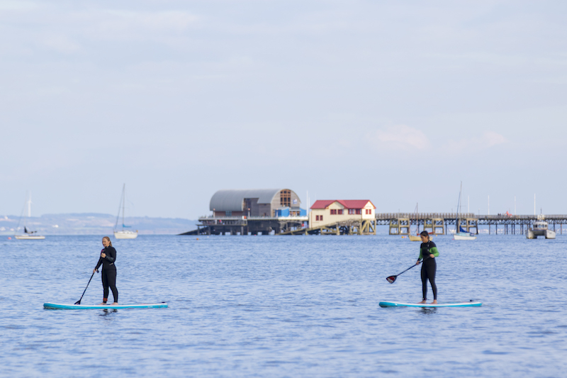 stand-up paddle boarding in Swansea bay best autumn activities in swansea bay