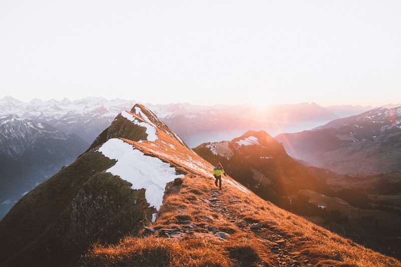 Mountain hiker at sunrise