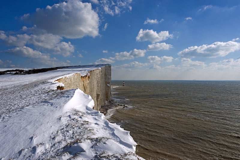 The seven sisters with a blanket of snow, best uk winter coastal hikes