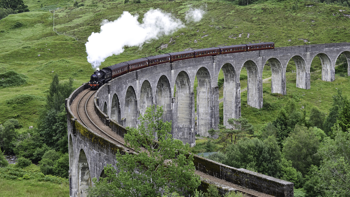 The Jacobite steam train on the Glenfinnan Viaduct, scotland, scenic train journeys