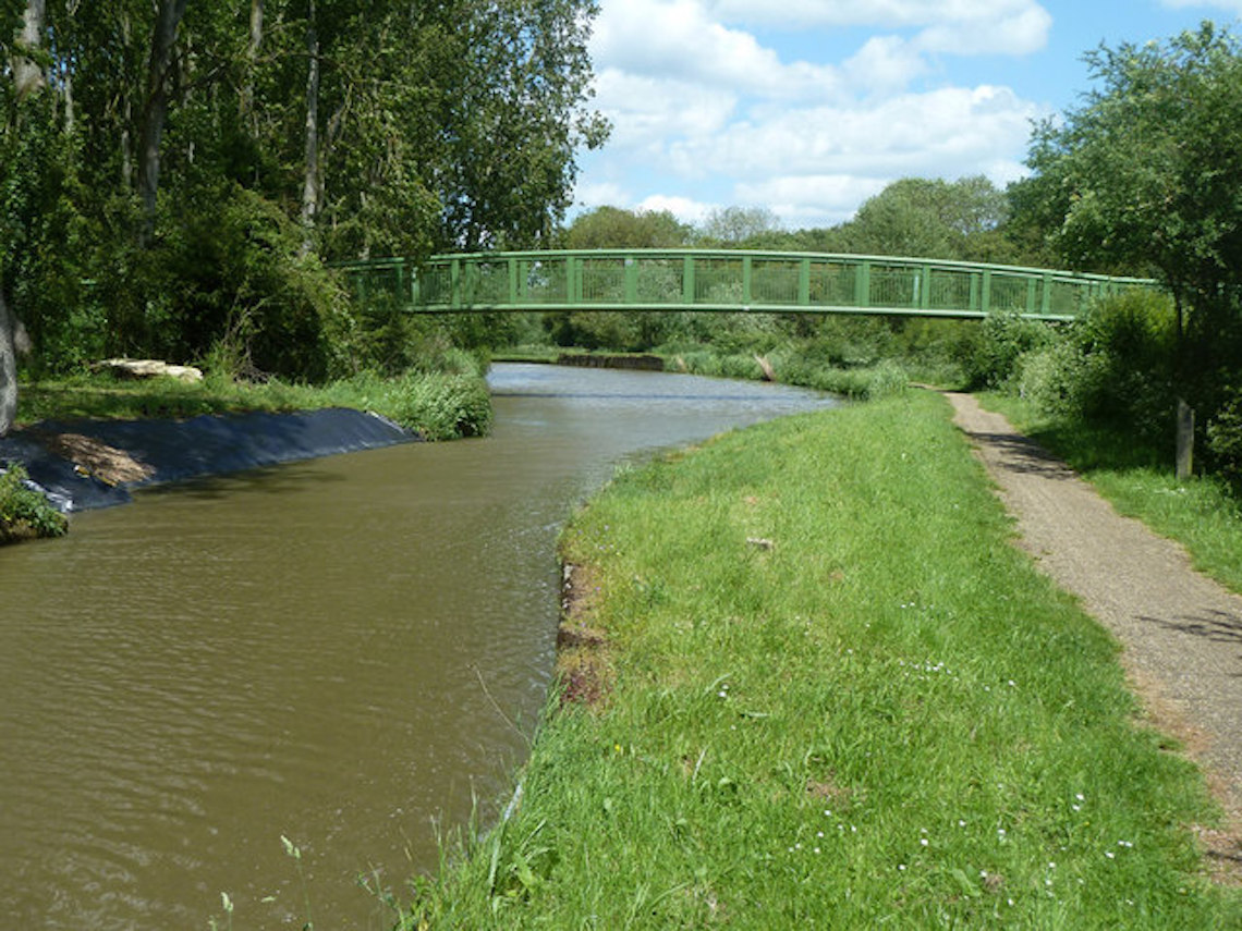 The union canal cycle path in Scotland with footbridge