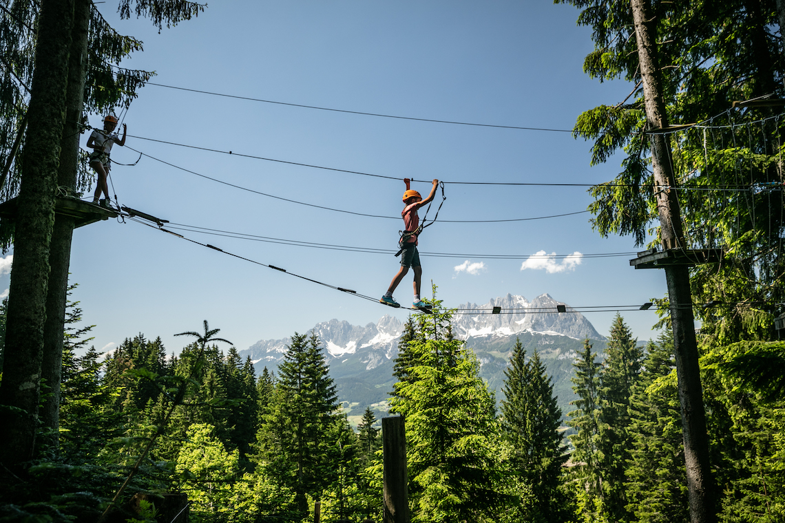 Child on ladder bridge at Hornpark - one of the best things to do in St Johann