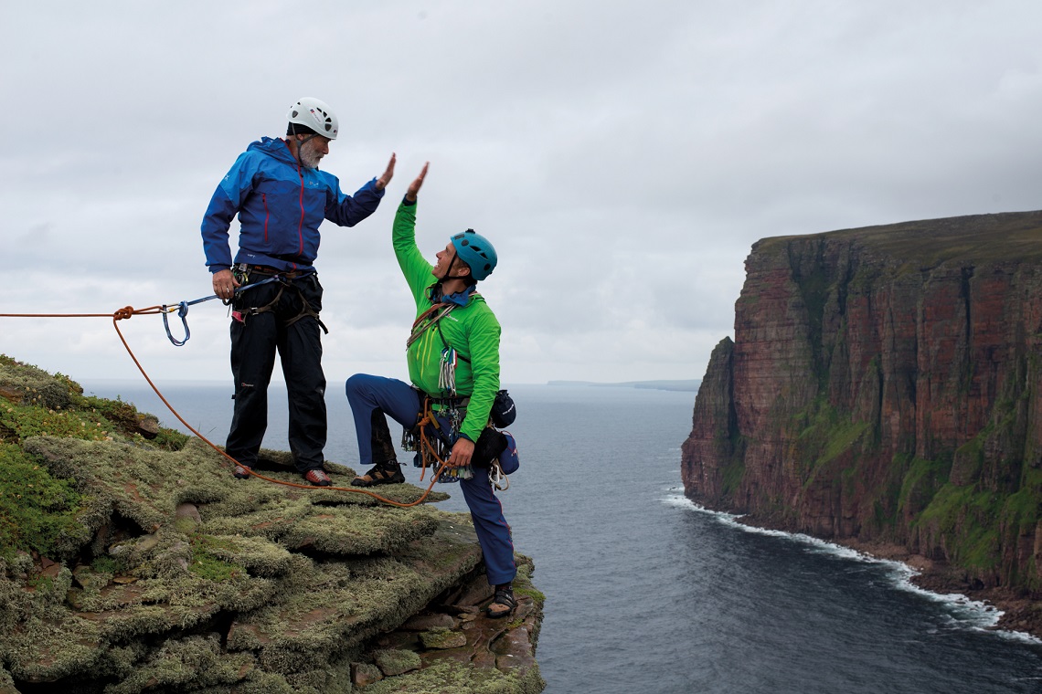 Sir Chris Bonington and Leo Houlding reach the summit of the Old Man of Hoy (photo credit - Berghaus)