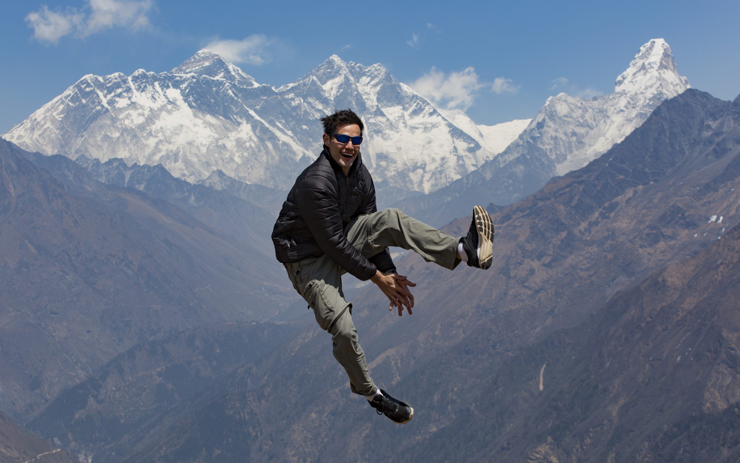 Elia jumping on a mountain