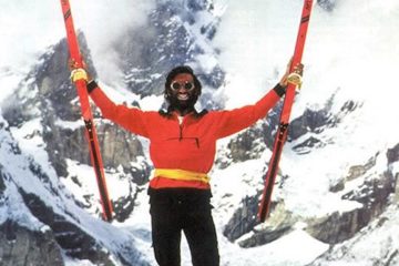 Ned Gillette holding skis