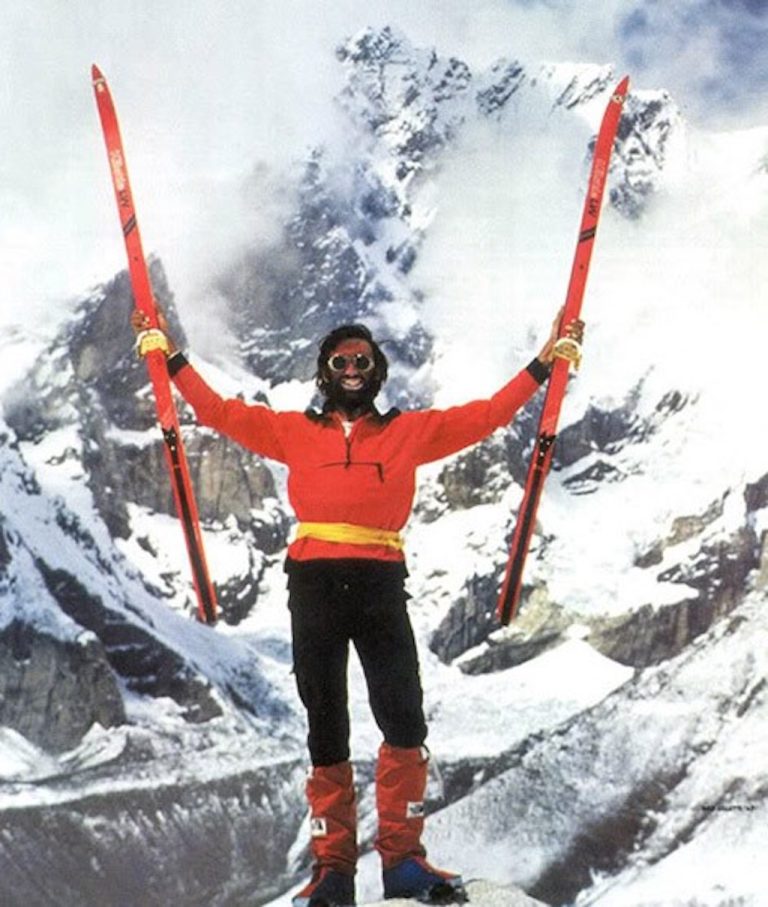 Ned Gillette holding skis