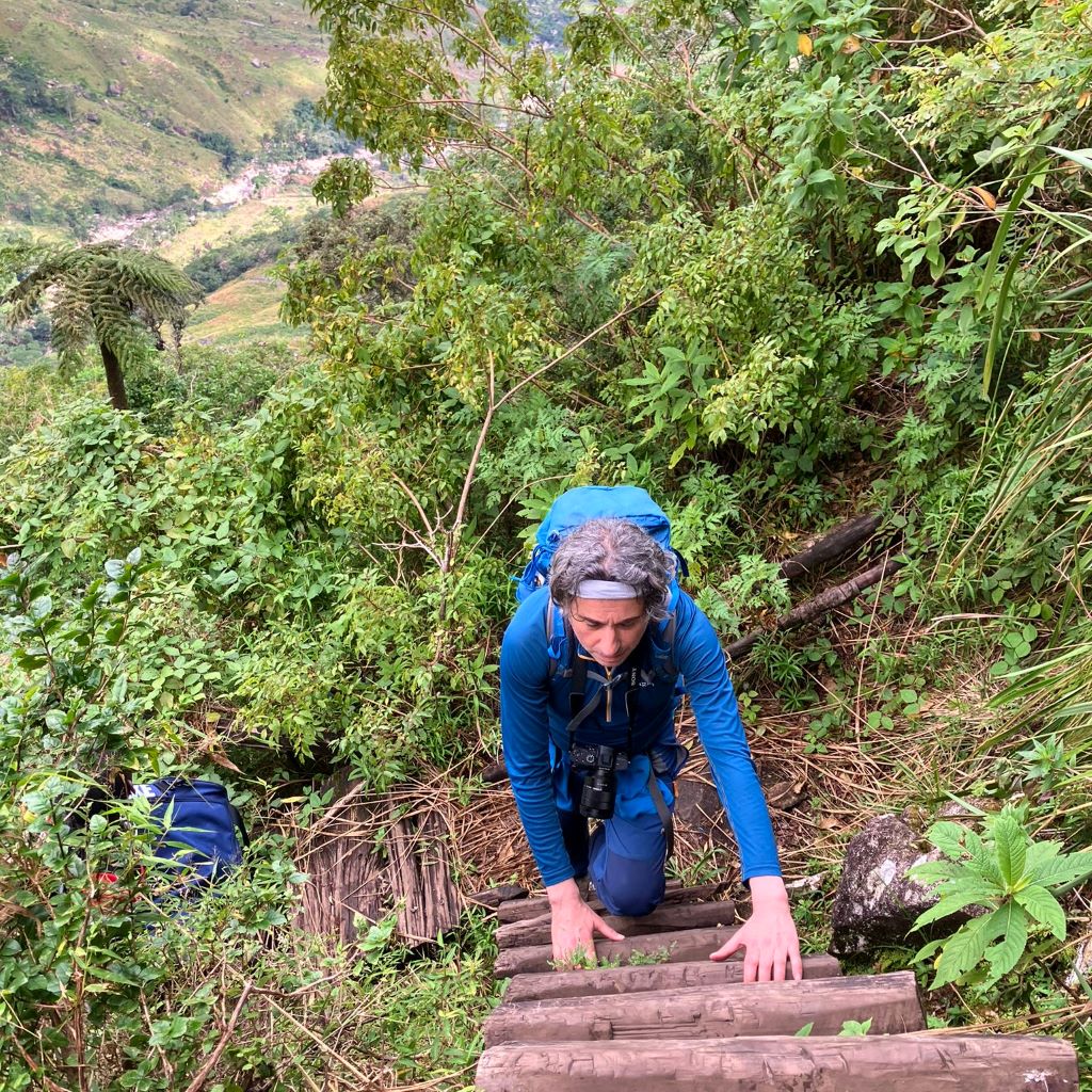 Peter on a ladder on Mount Mulanje